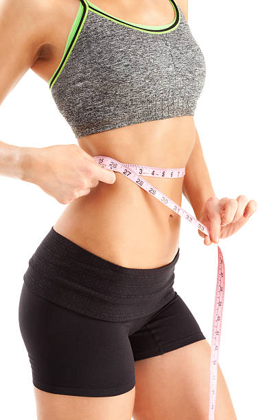 istock Slender Woman Measuring Waist 184302546