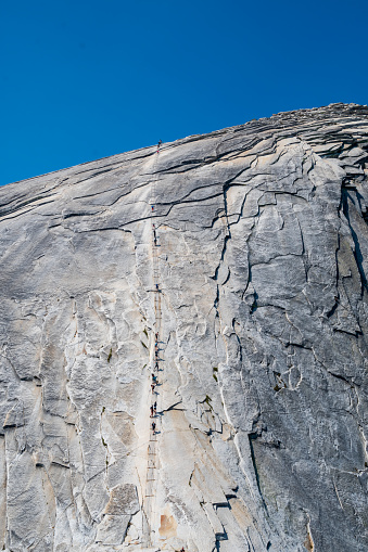 The top of the Half Dome with the dangerous cables on the top of the rock