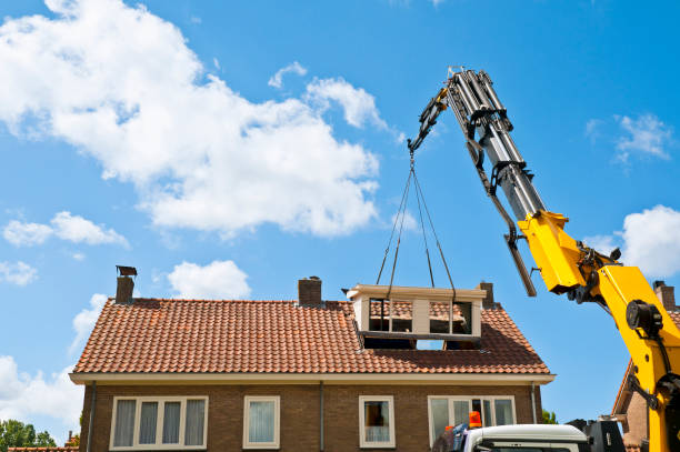 Dormer Construction A prefab dormer is raised with a crane to a hole in a roof Similar images: dormer stock pictures, royalty-free photos & images