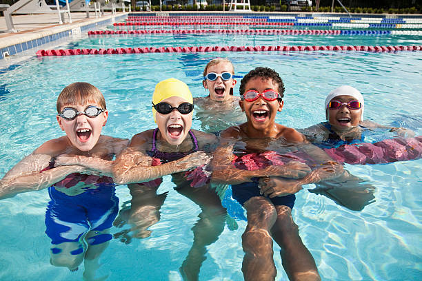 istock Multi-ethnic group of children shouting in swimming pool 184302945