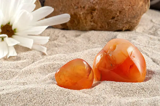 Photo collection of half-precious stones and gem stones. Here shown: Carnelian. 