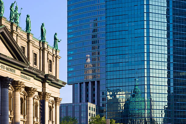 Montreal Canada Mary Queen of the World Cathedral and Reflections "The Cathedral-Basilica of Mary, Queen of the World and its reflection on the glass facade of skyscrapers in Montreal, Canada.The basilica is a scale model of Saint Peter's Basilica in Rome and is the seat of the Roman Catholic archdiocese of Montreal.See more images of Montreal:" mary queen of the world cathedral stock pictures, royalty-free photos & images