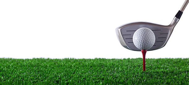 Golf ball on red tee with driver behind on white background ready for action.Panoramic.