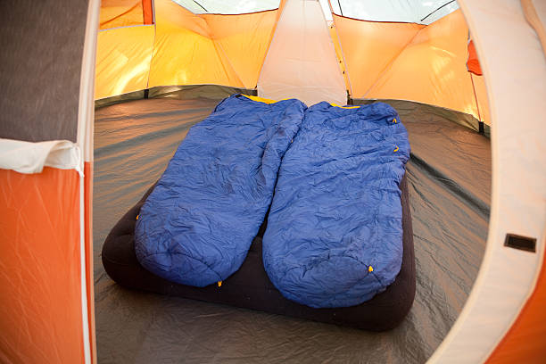 istock Sleeping bags and mattress inside a tent 184303624