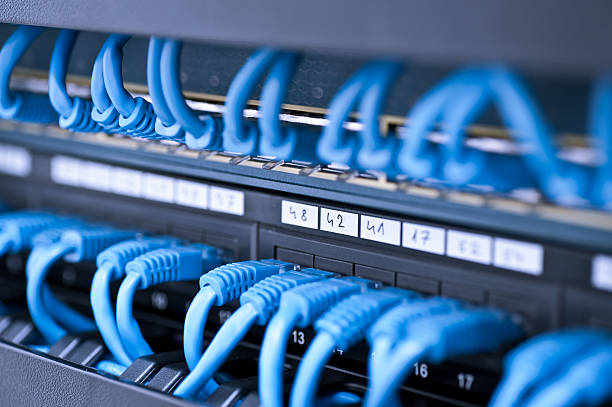 istock Many blue wires in a network hub 184305004