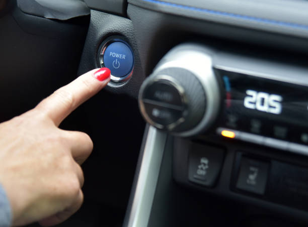 istock Female finger on the button to activate car engine 1843085540