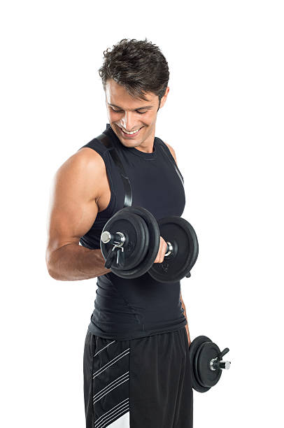 A young man exercising happily with Dumbbells