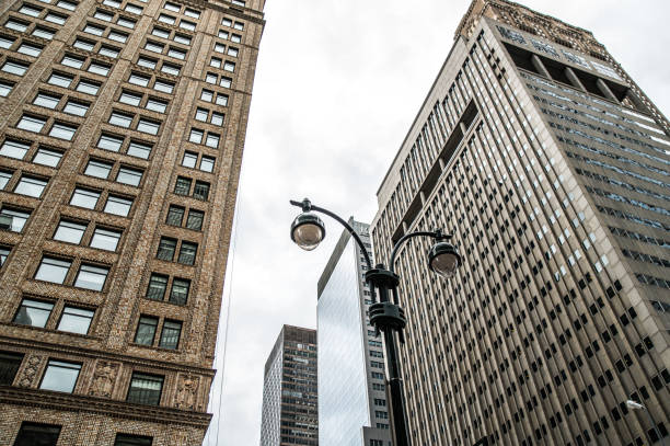 istock Modern skyscrapers in city under cloudy sky 1843097001