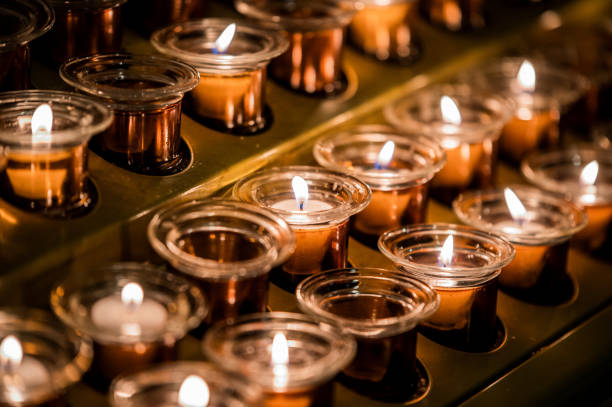 istock Set of burning candles in darkness 1843097518