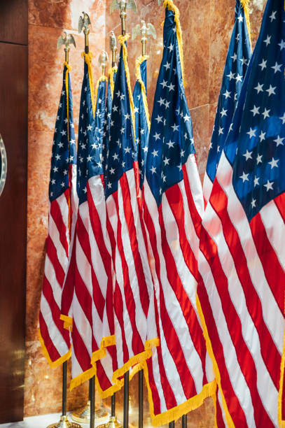istock American flags on stands in embassy hall 1843097538