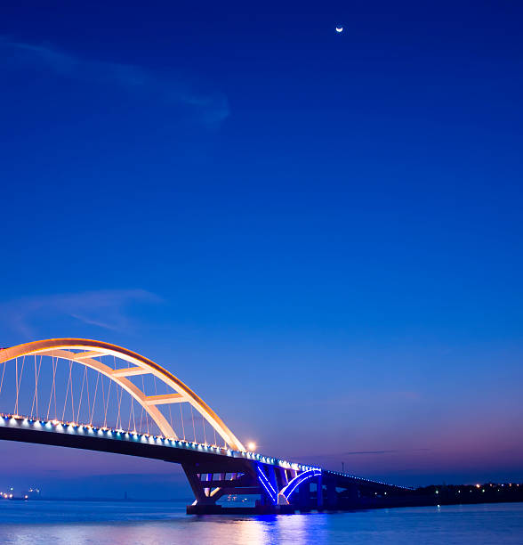 istock Xiamen wuyuan bridge and moon 184310106