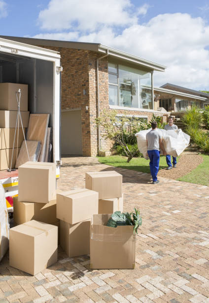 istock Movers carrying sofa from moving van to new house 184312538