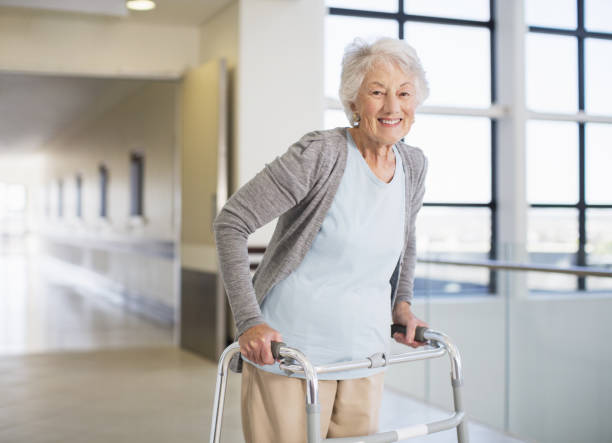 istock Senior patient using walker in hospital 184312610
