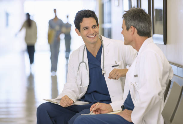 istock Doctors talking in hospital corridor 184312655