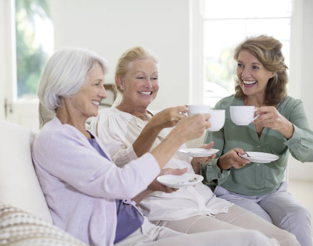 istock Senior women toasting coffee cups 184312794