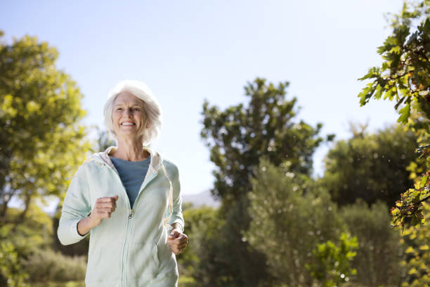 istock Senior woman running in park 184312808