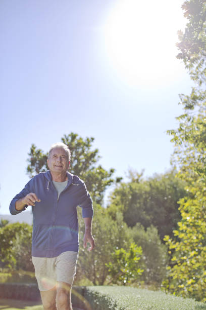 istock Senior man running in park 184312815