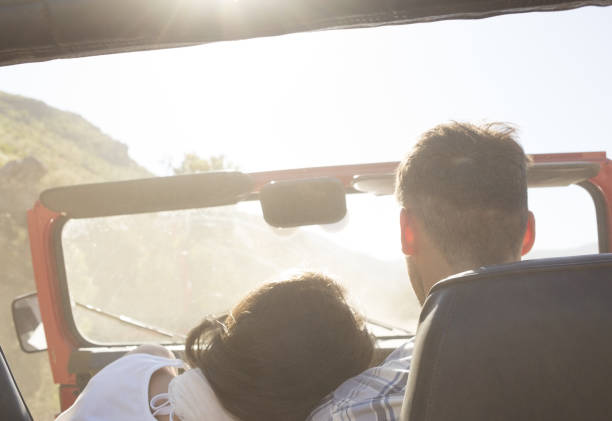 istock Couple driving sport utility vehicle 184313046
