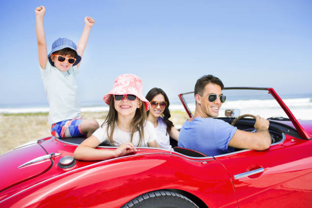 istock Family in convertible at beach 184313343