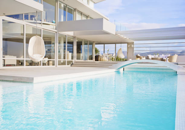 istock Swimming pool and modern house 184313611