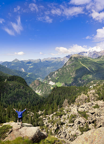 istock Man on the cliff enjoying freedom 184313728