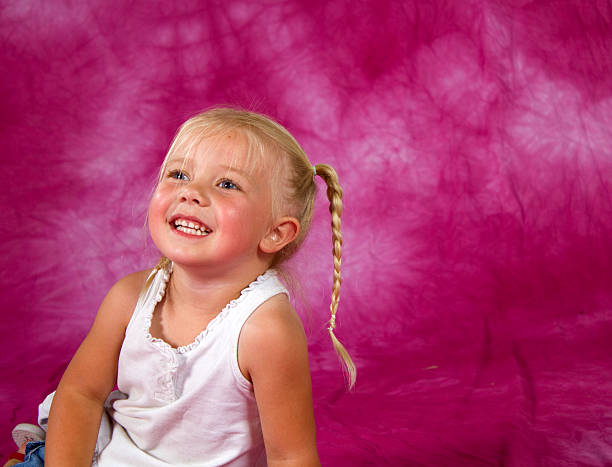 A young girl striking a pose in the studioA young girl striking a pose in the studioA young girl striking a pose in the studioA young girl striking a pose in the studio
