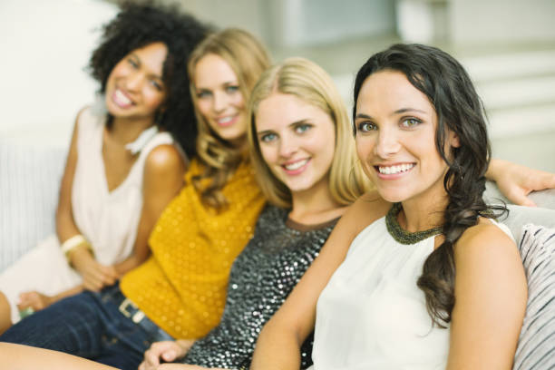istock Portrait of smiling women on sofa 184314149