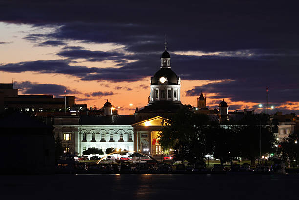 Kingston City Hall at Night "A closeup shot of Confederation basin, in Kingston Ontario, taken from Point Frederick with a long lens." kingston ontario photos stock pictures, royalty-free photos & images