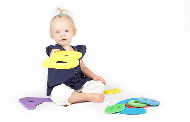 istock Little girl learning letters 184314768