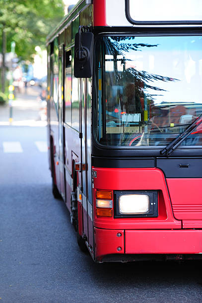 City bus front, moving against camera.