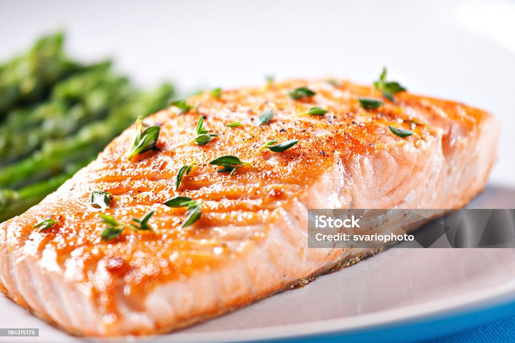 Fillet of salmon with asparagus Salmon - Seafood Stock Photo