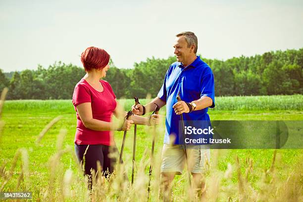Active Seniors Doing Nordic Walking Stock Photo - Download Image Now - 50-54 Years, Active Lifestyle, Active Seniors