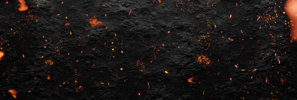 istock 3D rendering of rocky black surface covered by flying fire particles 1843152903