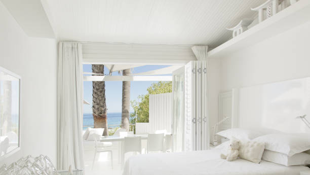 istock Modern bedroom overlooking beach and ocean 184315563