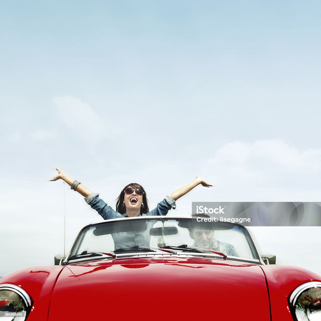 Couple in a red convertible Happy people in a cabriolet Car Stock Photo