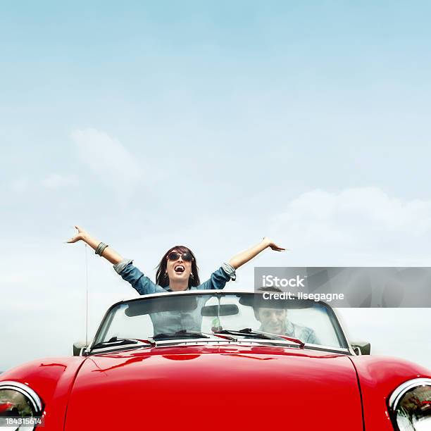 Couple In A Red Convertible Stock Photo - Download Image Now - Car, Red, Convertible