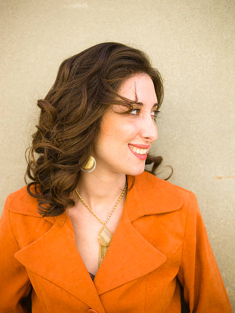 istock Girl in Orange Jacket Looking Away 184315834