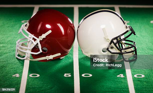 Two Football Helmets Stock Photo - Download Image Now - Football Helmet, Two Objects, Helmet