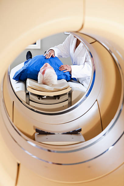 istock Radiologist preparing patient for PET-CT scanner. 184316136