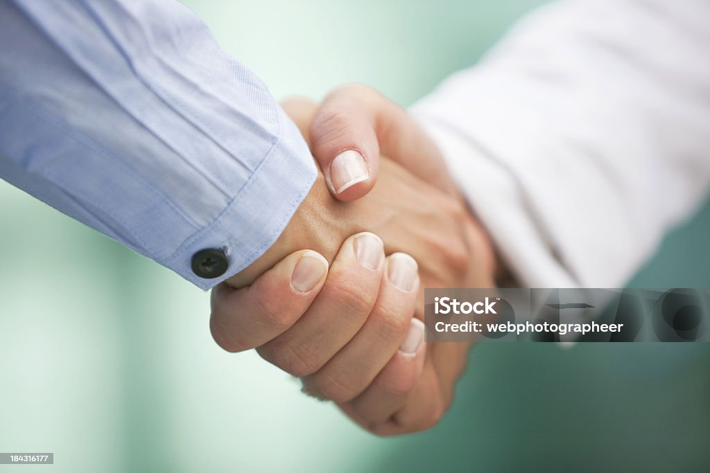 Closeup of handshake "Shaking hands, Canon 1Ds mark III" Close-up Stock Photo