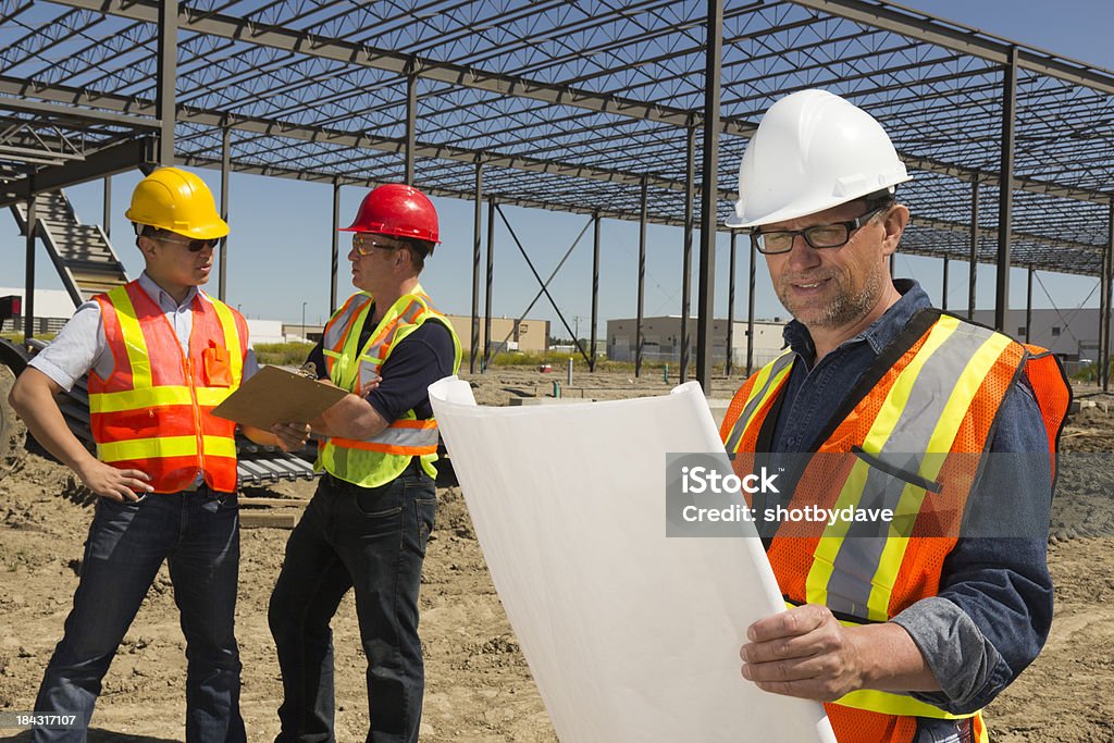 Construcción Trio - Foto de stock de Agrimensor libre de derechos