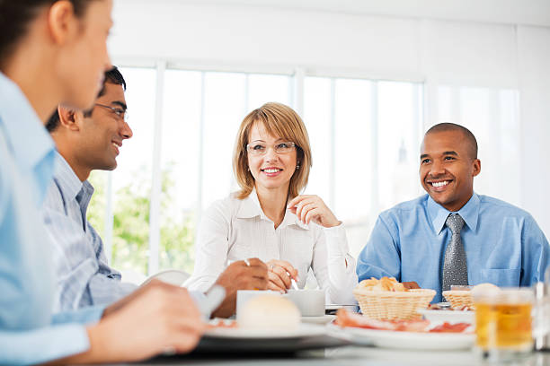 istock Businesspeople having lunch indoors. 184317466