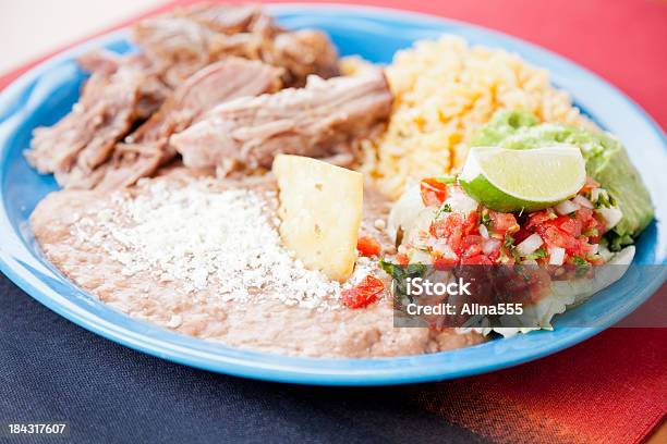 Mexican Food Carnitas Cilantro Rice And Refried Beans Stock Photo - Download Image Now