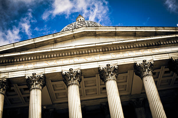 London, UK - March 21, 2015: The National Gallery in Trafalgar Square in central London. Photo taken during an overcast day and contains many people visiting the museum.