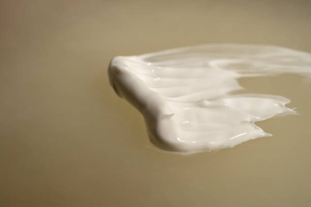 istock A smear of cream on a light background. Beauty concept. 1843178184