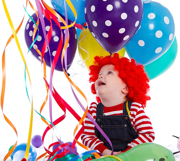 12 months toddler as a clown in a party