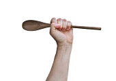 Hand Holding Wooden Spoon