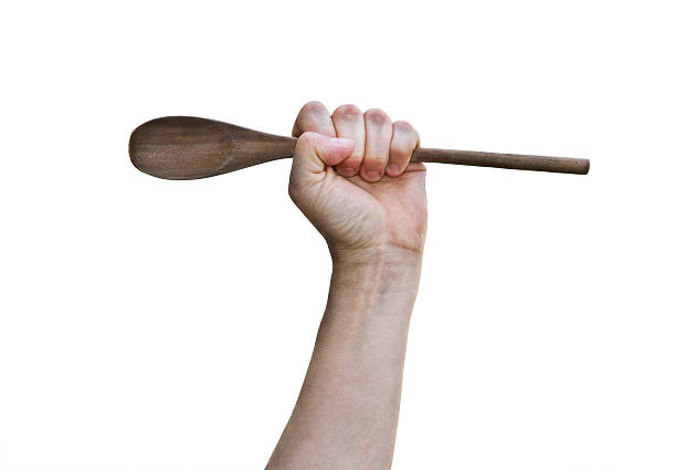 Hand Holding Wooden Spoon Spoon Power ... Let's Cook! wooden spoon stock pictures, royalty-free photos & images