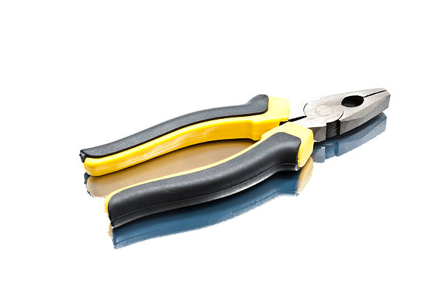 Black and yellow pliers stock photo