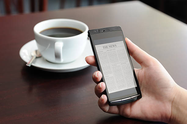 istock Reading news on mobile phone 184318213